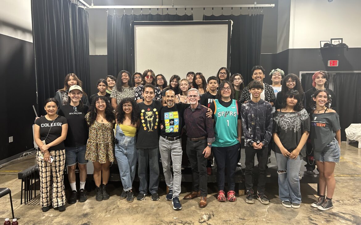 This is an image of a group of Summer SAY Sí theatre students and teaching artists smiling at the camera.
