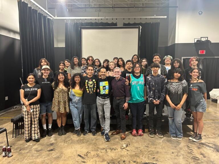 This is an image of a group of Summer SAY Sí theatre students and teaching artists smiling at the camera.